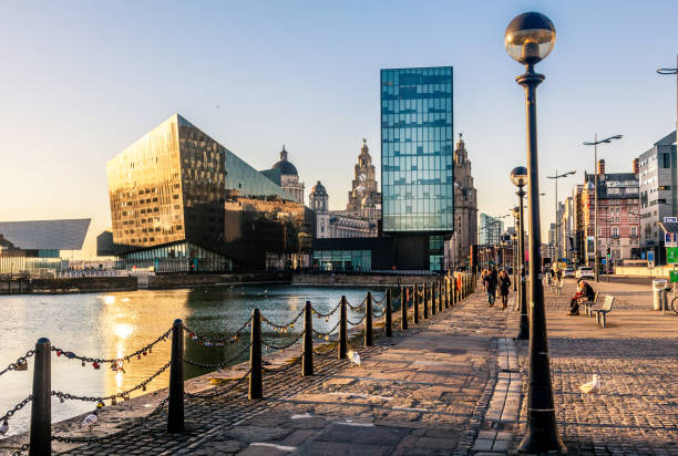 Liverpool Skyline Liverpool, UK - February 25, 2017: View across the Albert Dock, Liverpool show the city skyline. There are people in the photograph. pierhead liverpool stock pictures, royalty-free photos & images