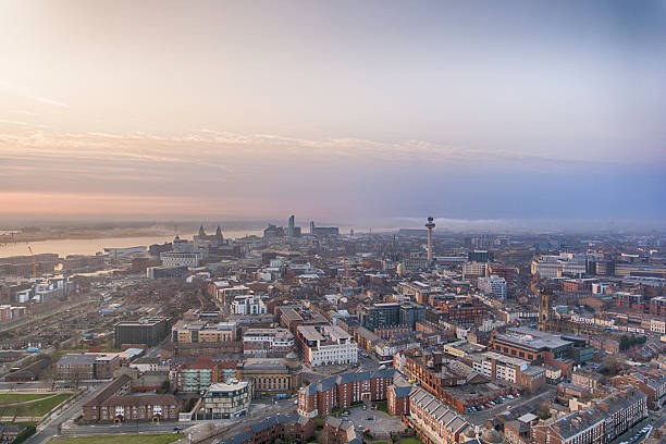 Liverpool Sunset View over Liverpool looking towards The Liver Buildings, Pier Head and the river Mersey. Taken from the top of the Cathedral. pierhead liverpool stock pictures, royalty-free photos & images