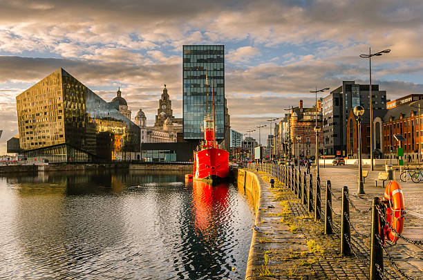 Liverpool Waterfront at Sunset Liverpool's historic waterfront with modern and old architecture at sunset liverpool england stock pictures, royalty-free photos & images