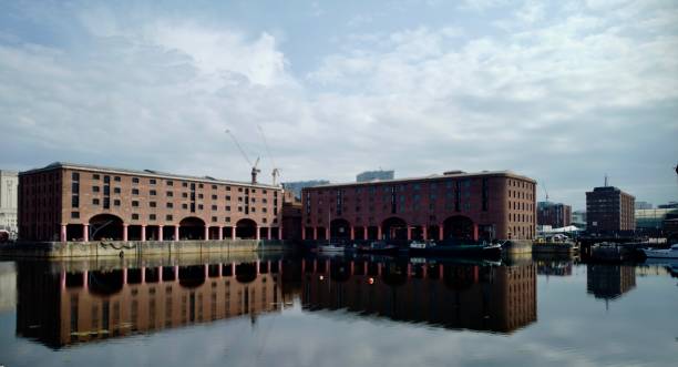 Liverpool Waterfront Liverpool, England- July 16,2019: The Pier Head in the center of Liverpool on the River Mersey consist of ware gin Albert Dock a UNESCO World Heritage Site and the Three Graces, Royal Liverpool Building, The Cunard Building, and the Port of Liverpool. cunard building liverpool stock pictures, royalty-free photos & images