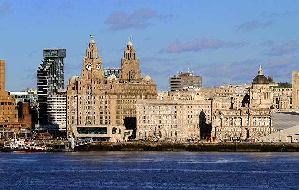 Liverpool Waterfront Liverpool's world famous iconic three graces  waterfront buildings including the Mersey Ferry liverpool docks and harbour building stock pictures, royalty-free photos & images