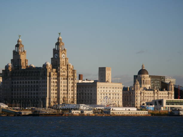 Liverpool Waterfront Liverpool's UNESCO listed waterfront showing the Three Graces - The Royal Liver Building, the Cunard Building and the Port of Liverpool Building. cunard building liverpool stock pictures, royalty-free photos & images