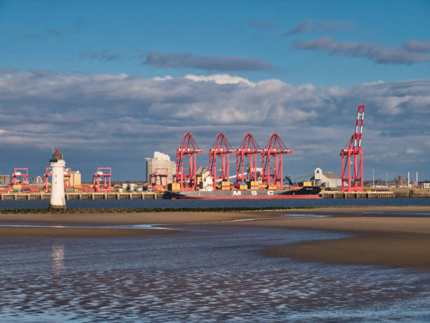 Liverpool2 - a £400 million deep-water container terminal at the Port of Liverpool Liverpool2 - a £400 million deep-water container terminal at the Port of Liverpool, with container ship MSC Monica berthed. New Brighton lighthouse appears on the left. river mersey liverpool stock pictures, royalty-free photos & images