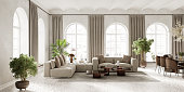 istock living room inderior with arch windows, furnished with modern sofa and dining table, 3d render 1369575590