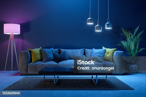 istock Living Room Interior At Night With Sofa, Floor Lamp, Potted Plants And Neon Lighting 1322620545