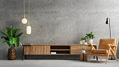 istock Living room interior have cabinet for tv and leather armchair in cement room with concrete wall. 1329433253