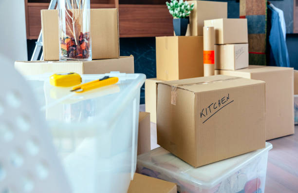 Living room with moving boxes stock photo