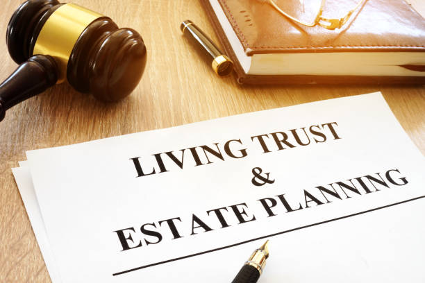 Living trust and estate planning form on a desk. Living trust and estate planning form on a desk. mansion stock pictures, royalty-free photos & images