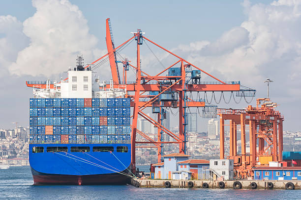Loading Cargo On A Container Ship stock photo
