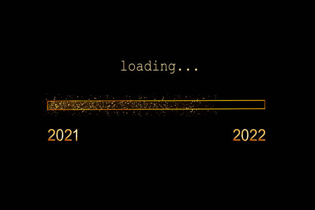 2022 loading, gold glitter progress bar on black background, new year holiday greeting card stock photo
