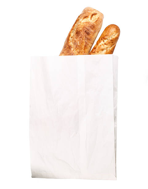 loaf of baguette paper bag stock photo