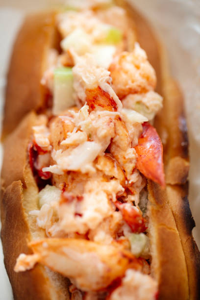 Lobster roll-lobster meat and celery on toasted roll stock photo