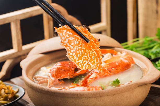 Lobster Seafood congee in a casserole stock photo