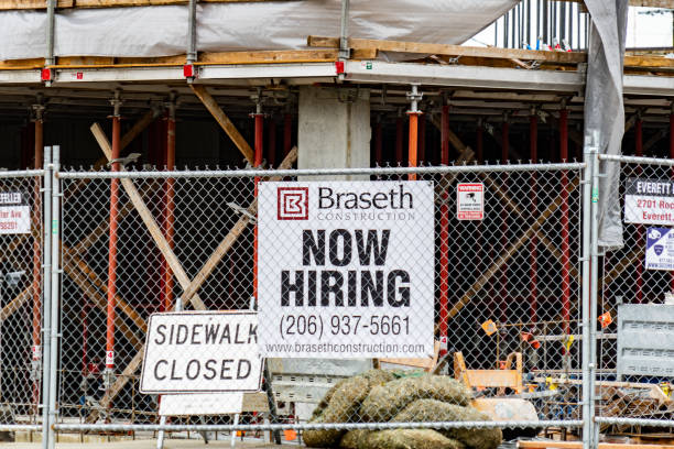 Local Construction Business Now Hiring Sign Looking for New Employees stock photo