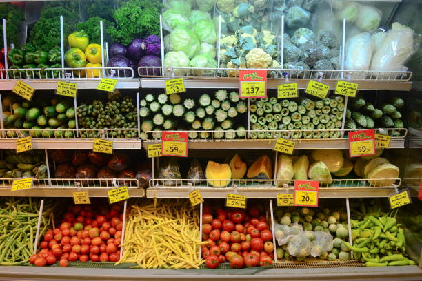 Local vegetables with prices in grocery supermarket. stock photo