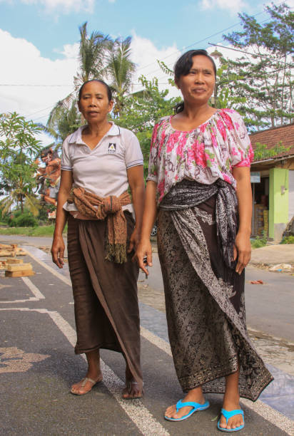Local women in Bali, dressed in batik stock photo