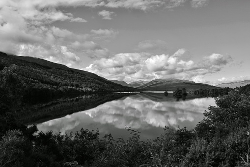 Clouds and mountains reflected in Loch Lochy Scotland