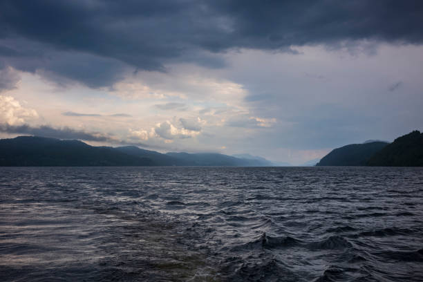 Loch Ness, a large, deep, freshwater loch in the Scottish Highlands  best known for alleged sightings of the Loch Ness Monster, on a stormy day. stock photo