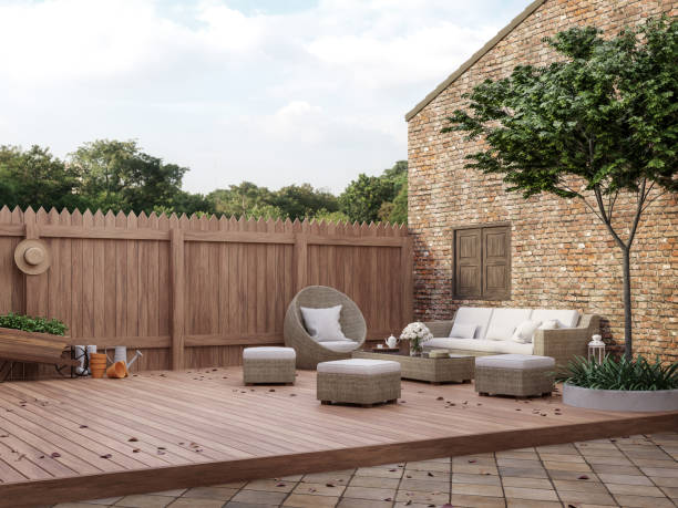 Loft style outdoor living area 3d render Loft style outdoor living area 3d render,There are wooded and clay tiles floor,old brick wall and wooden fence Decorated with rattan furniture sets Looking out to see the natural scenery courtyard stock pictures, royalty-free photos & images