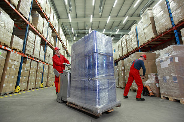 Logistics,two workers working in storehouse stock photo