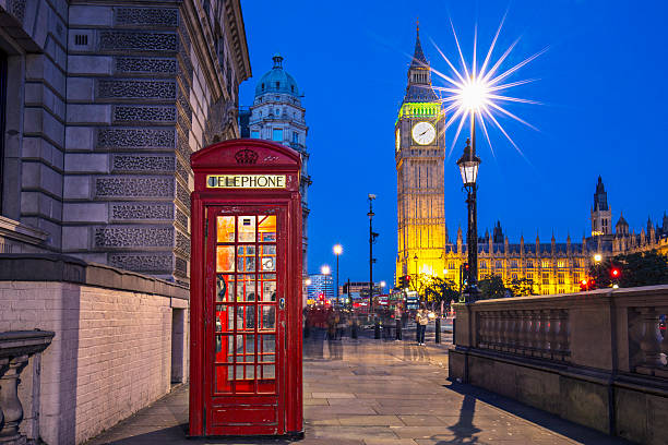 London at dusk Red Telephone booth with Big Ben in the background . red telephone box stock pictures, royalty-free photos & images