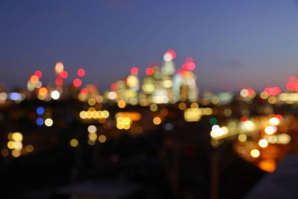London night defocused skyline Night city lights - defocused evening skyline of London UK. Blurred cityscape. central london stock pictures, royalty-free photos & images