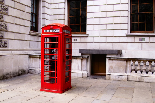 Photo of a red phonebooth in downtown London.
