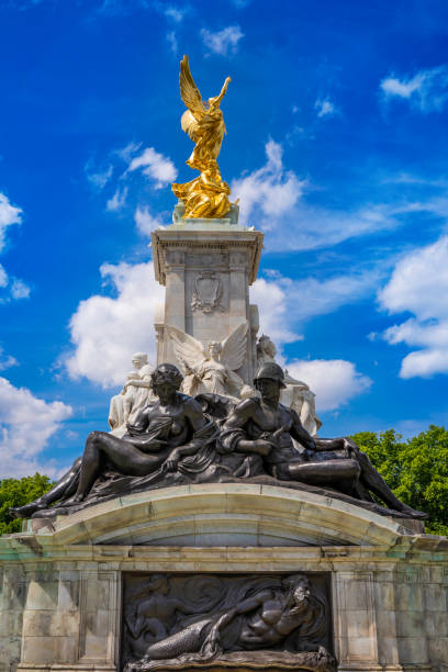 London Queen Victoria Memorial fountain in Buckingham Palace in a summer day London Queen Victoria Memorial fountain in Buckingham Palace in a summer sunny blue sky day. Created in Carrara marble and commemorating the death of Queen Victoria in 1901 1901 stock pictures, royalty-free photos & images