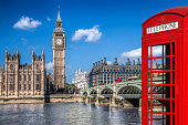 istock London symbols with BIG BEN, DOUBLE DECKER BUSES and Red Phone Booth in England, UK 1294454411