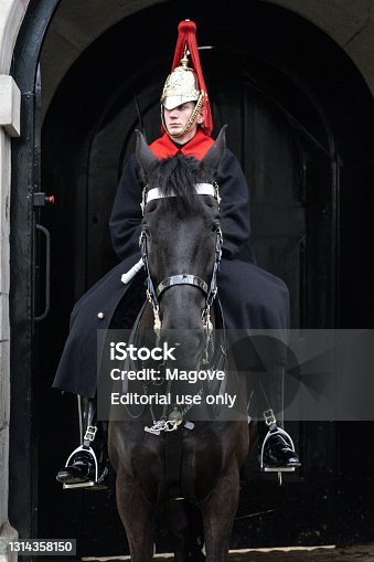 istock London, UK-  Black Horse Under The Black Horse Under The Guardsman In Red Coat And Black Jackboot in London, United Kingdom June 7, 2018 In Red Coat And Black Jackboot June 7, 2018 1314358150