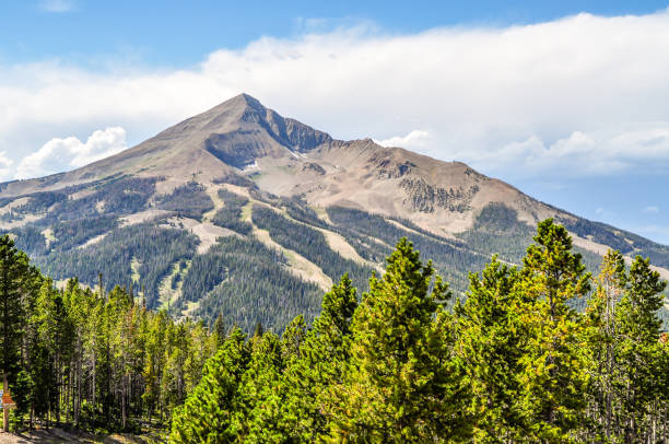 Lone Peak Rises High Above the Forests of Montana stock photo