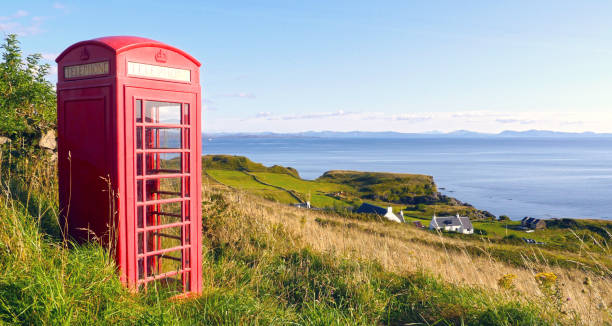 Lonely red phone booth in the countryside at Isle of Skye, Scotland, UK stock photo