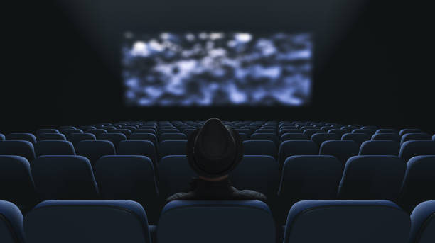Lonely spectator at the cinema. Back view stock photo