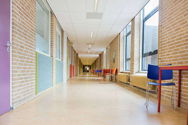 Long corridor with furniture in school building stock photo