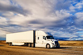 istock Long Haul Semi Truck On a Rural Western USA Interstate Highway 1351511686