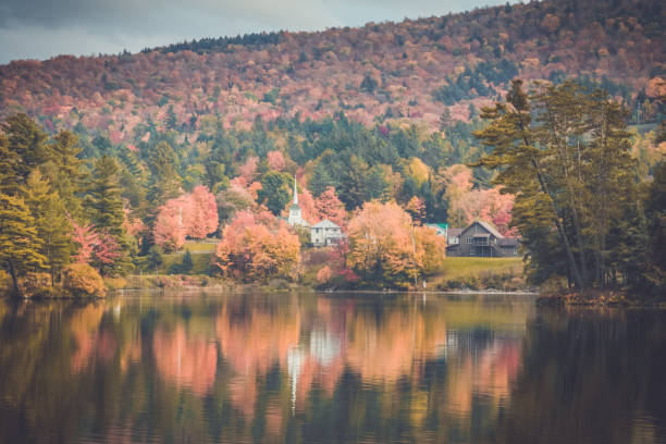 Photo of Long Lake, Adirondacks, NY, in the fall surrounded by brilliant colorful foliage