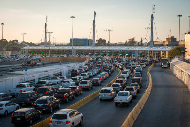 Long line of cars crossing Mexican border at Tijuana/San Ysidro stock photo