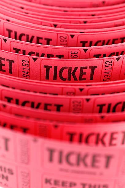 Long roll of pink tickets close up stock photo