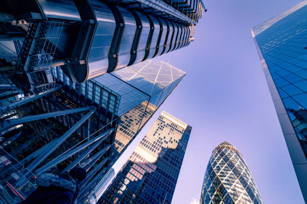 Looking directly up at the skyline of the financial district in central London, United Kingdom - creative stock image stock photo