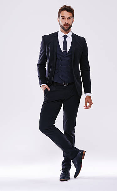 Looking good in a suit Studio shot of a handsome and well-dressed young manhttp://195.154.178.81/DATA/shoots/ic_784174.jpg tuxedo stock pictures, royalty-free photos & images