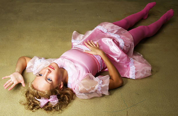 looks alive young woman in dolls dress laying on floor broken doll 1 stock pictures, royalty-free photos & images