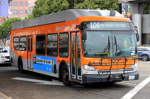 Los Angeles, California, USA - September 26, 2021: Los Angeles Metro bus line 106 (Local Orange Livery) running at Downtown Los Angeles.