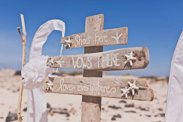 Love everywhere beach wedding sign stock photo
