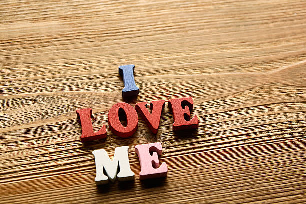 I Love Me   letters   on   wood stock photo