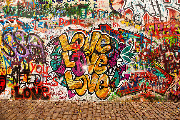Love On The Lennon Wall "Prague, Czech Republic - October 7, 2010:  Graffiti on the Lennon Wall in October 2010 in Prague." graffiti stock pictures, royalty-free photos & images