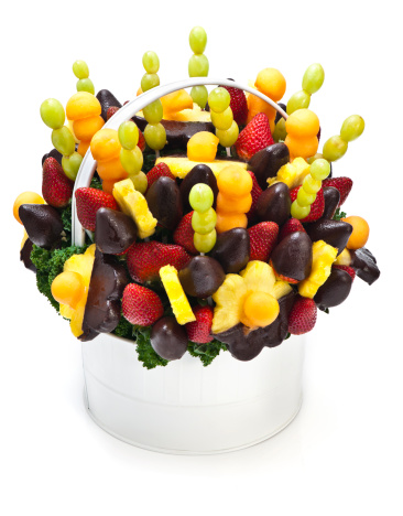 Edible bouquet made out of fruit dipped in chocolate. Isolated on white with soft shadow.