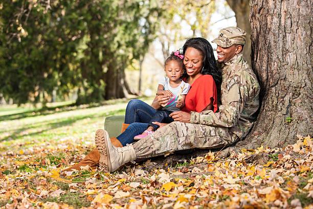 Loving Young Military Family at Park stock photo