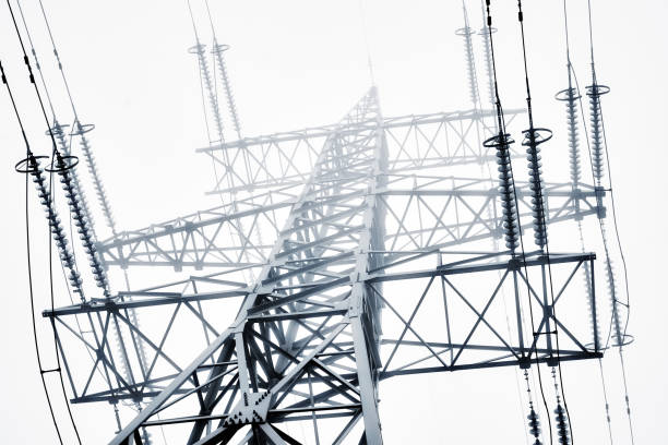 Low Angle View Of Electricity Pylon Against Clear Sky stock photo