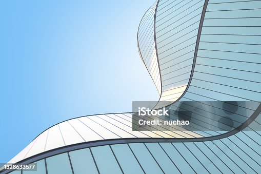 istock Low angle view of futuristic modern architecture, Skyscraper of corporate office building, Curve shape, 3D rendering. 1328633577