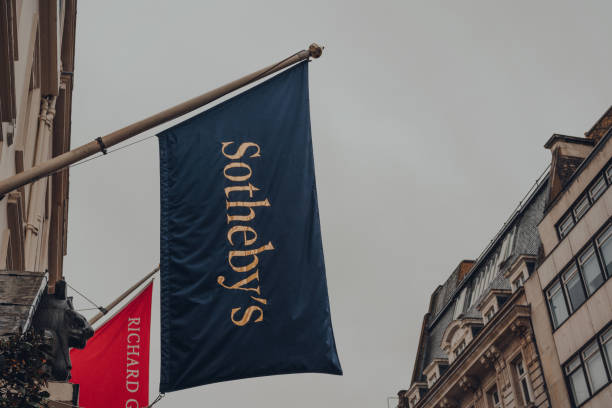 Low angle view of the flag outside Sotheby's auction house on New Bond Street in London, UK. stock photo